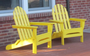 Yellow Adirondack chairs on the front deck